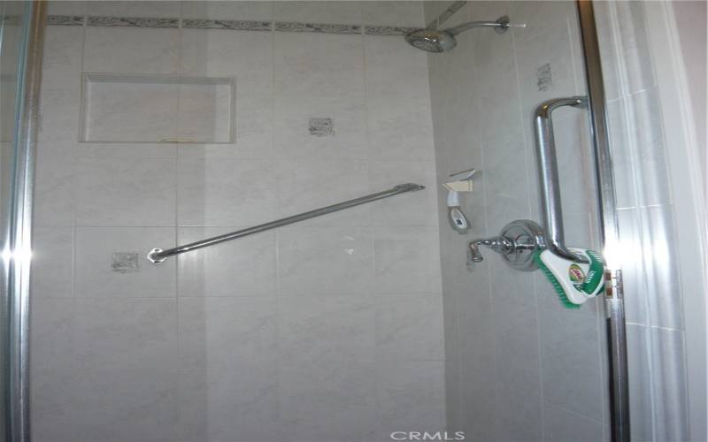 large walk-in shower in primary bathroom