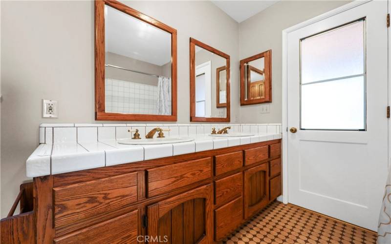 Enjoy this clean and sparkling primary bathroom with a tub.