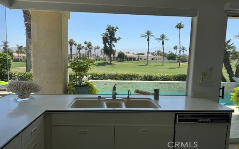 Kitchen looking out to pool and golf course