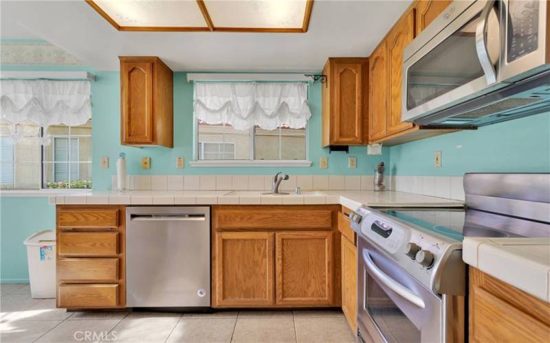 Bright kitchen is as cute as can be!!
