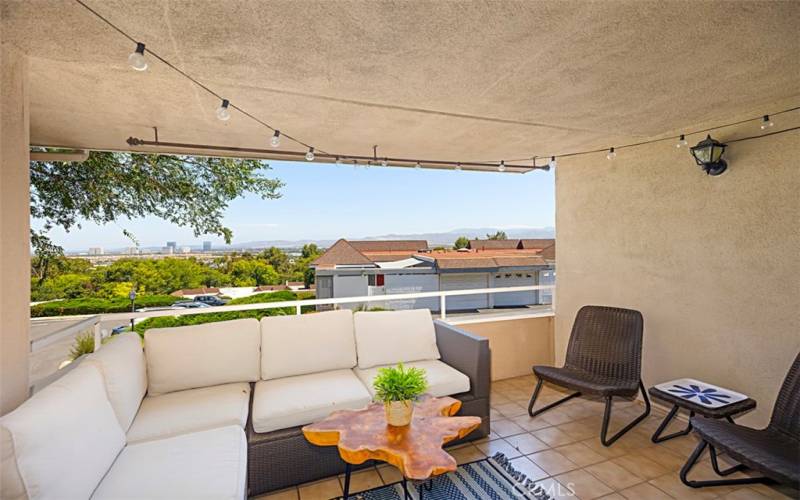 This outdoor balcony is designed for all seasons, offering a perfect spot to enjoy your morning coffee while soaking in the breathtaking views.