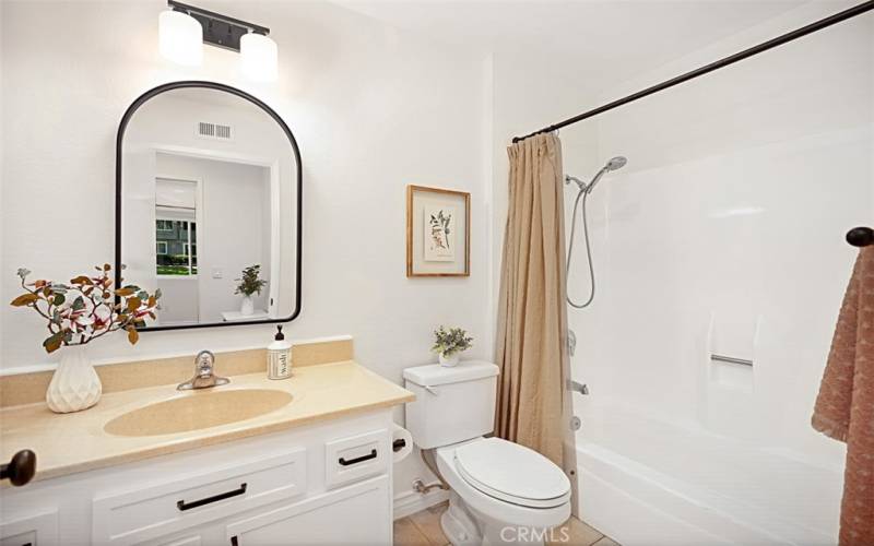 Step into the hallway full bath, complete with a convenient storage cabinet to neatly organize all your beauty essentials. Enjoy the option of a shower and tub combo, making it a versatile and functional space for your daily routines.