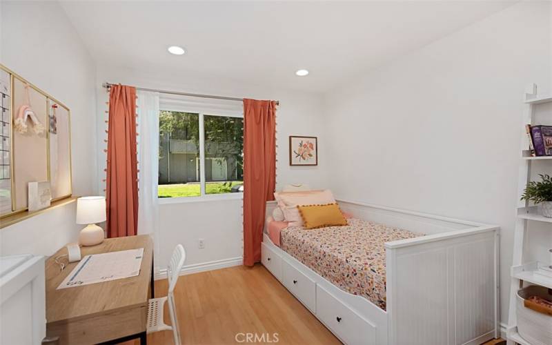 Bedroom 2 is so adorable. Recently painted with a fresh coat, it features stylish recessed lighting and sleek laminate flooring, creating a cozy and fun atmosphere.