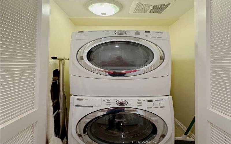 Laundry area with stacked washer/dryer