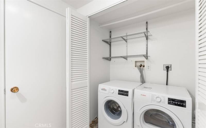 Front loading washer/dryer to guest bathroom closet.