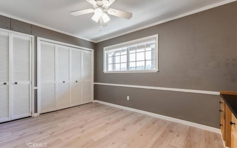 Bedroom with loads of closet space and built in desk