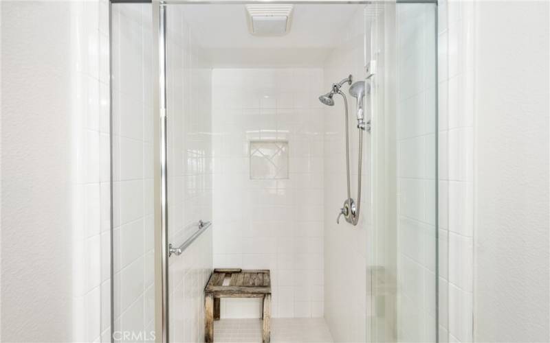 featuring a deep tub and walk-in shower