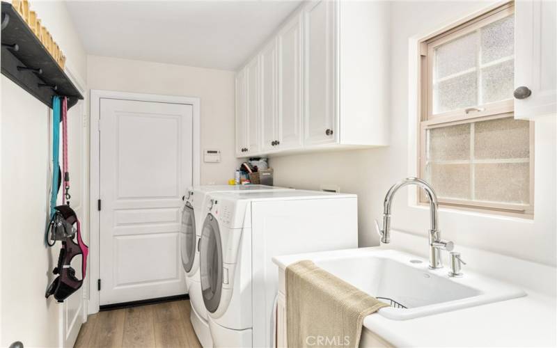 a separate, main-level laundry room with storage closet