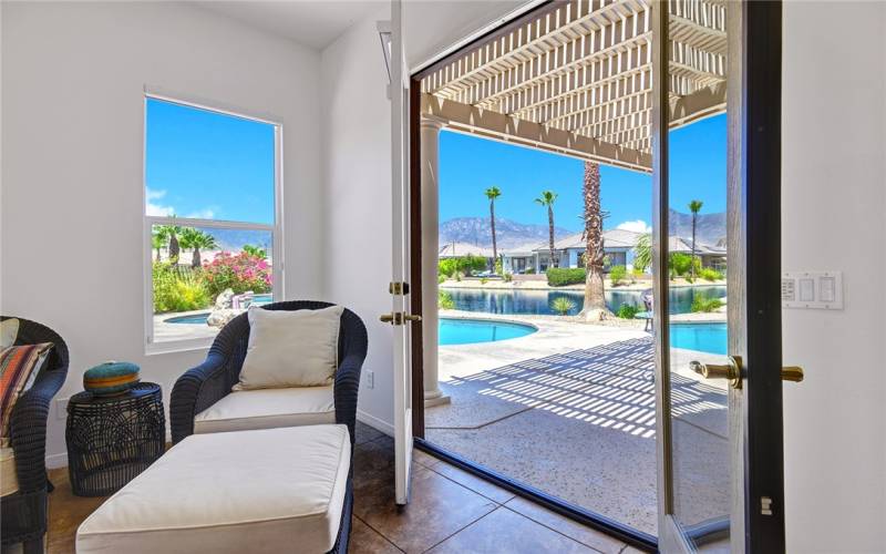 french doors leading to back patio, pool and views.