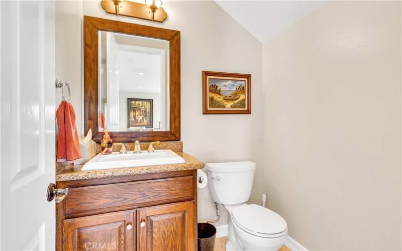 Downstairs powder room for the  convenience of your guests.