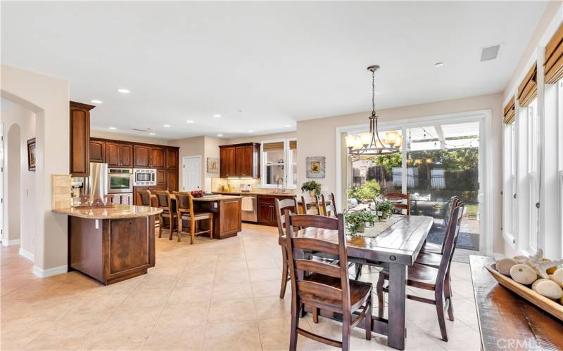 The heart of the home is the large kitchen with massive storage and a dining area.