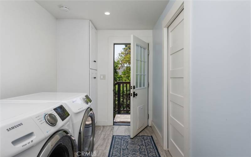 Indoor Laundry Leading to Backyard