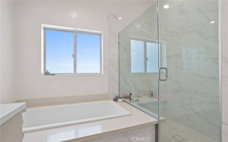 Primary bath with soaker tub and walk in shower