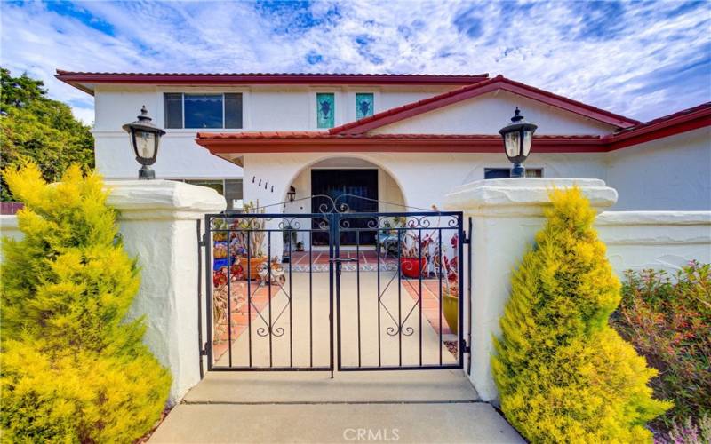 Entrance to gated patio in the front of the house.