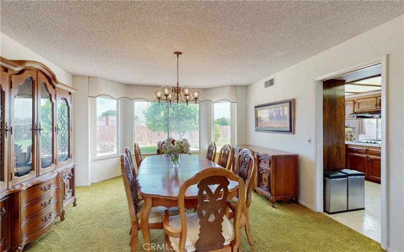 Formal dining room with bay window.