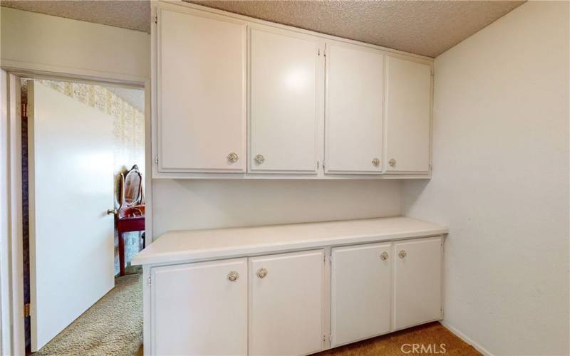 Hallway with built in cabinets.