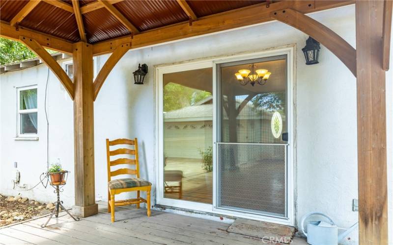 The sliding glass door opens to a gazebo covered deck.