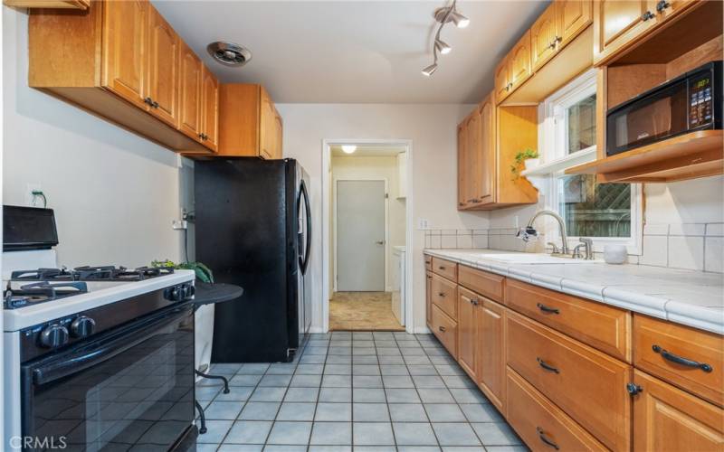The kitchen offers tiled floors and countertops.