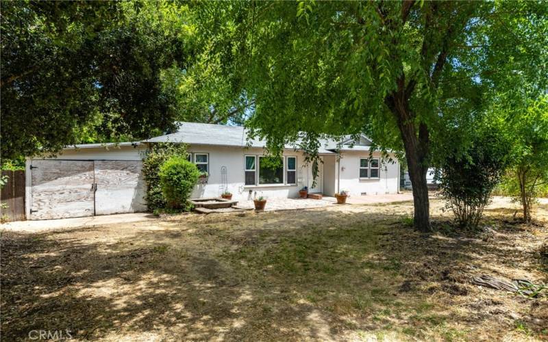 The property offers plenty of parking. The sizeable driveway leading up to the carport is large enough to accommodate a boat or smaller trailer/RV