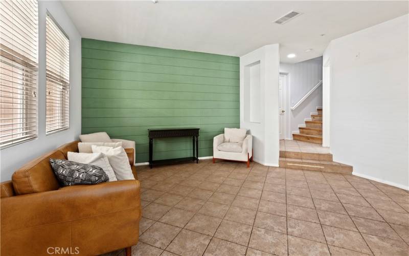 Beautiful entry way that opens to a family room