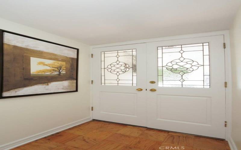 Let's go bak inside through the leaded beveled glass double door entry with refinished wood floors and fresh paint.