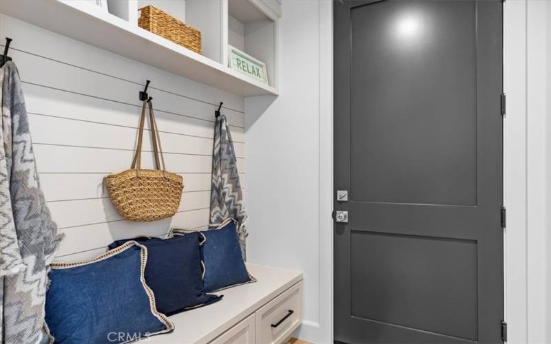 Mud room with access to epoxy coated garage