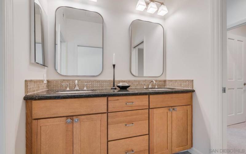 Stylish Jack & Jill bathroom separating the two secondary bedrooms.