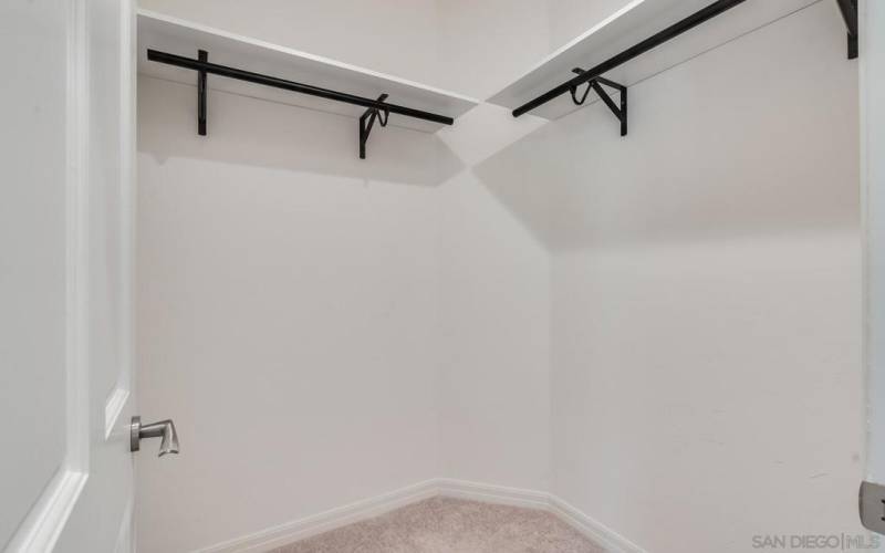 Walk-in closet of the Secondary Bedroom.