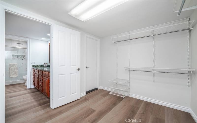 Primary room has a huge walk in closet that opens to the Dual sink area and Shower. The flooring is luxury vinyl planks and fully moisture and water proof.