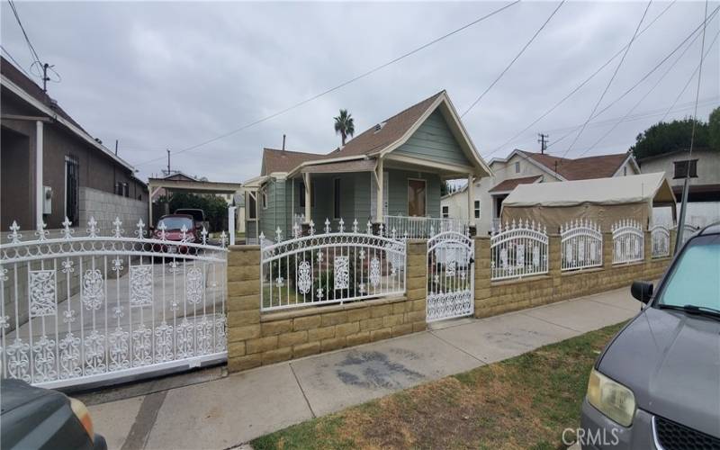 FRONT VIEW WITH DRIVEWAY & CARPORT