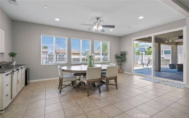 Huge dining area with ceiling fan.