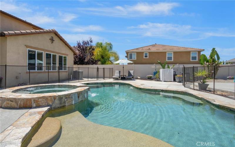 Gorgeous pool & spa with professionally installed removable fence.