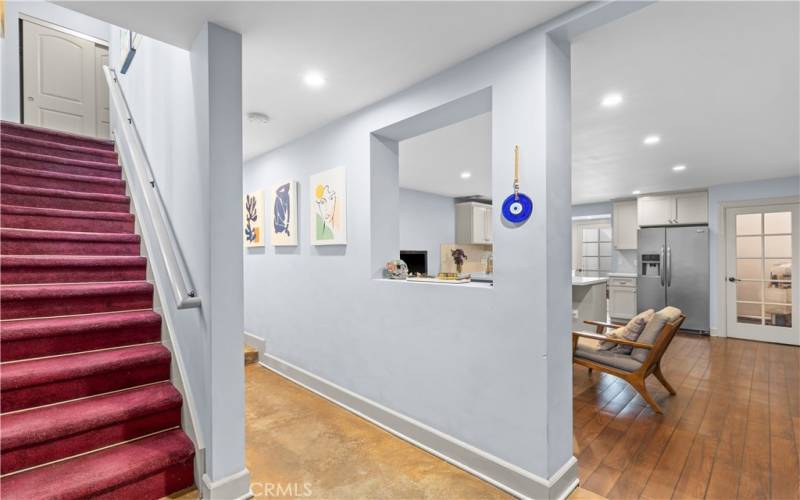 Foyer leading to the open living room and kitchen area.