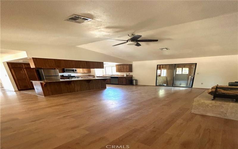 Family room with Laminate wood floors and fireplace