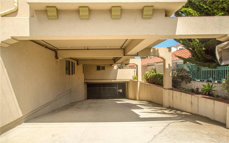 Garage entrance with elevator access to condo level