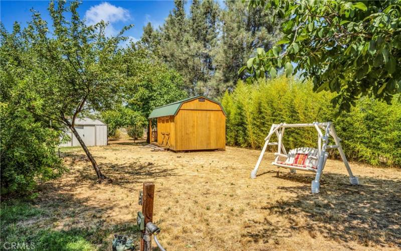 Storage barn with covered deck