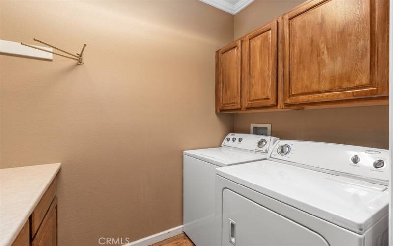 full laundry room with built-ins with plenty of storage