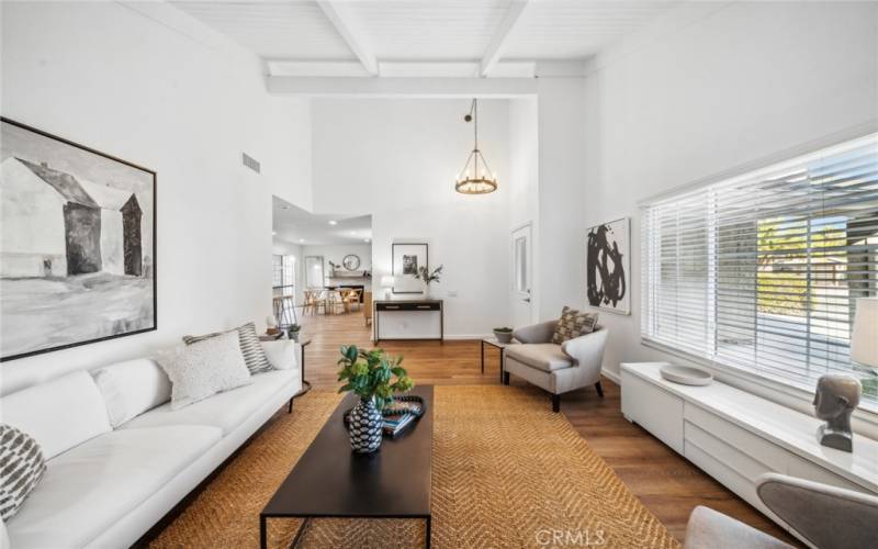 Luxury Vinyl Plank flooring leads to generously sized great room w/cathedral ceiling