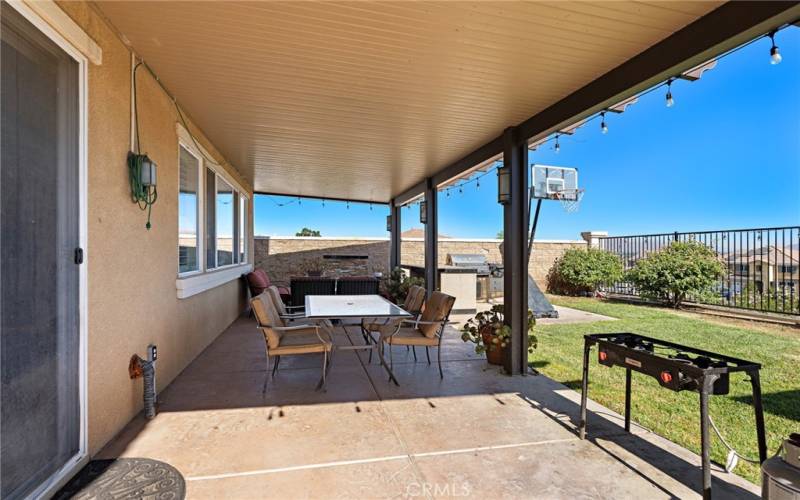 COVERED PATIO W/ OUTDOOR SEATING & BBQ AREA