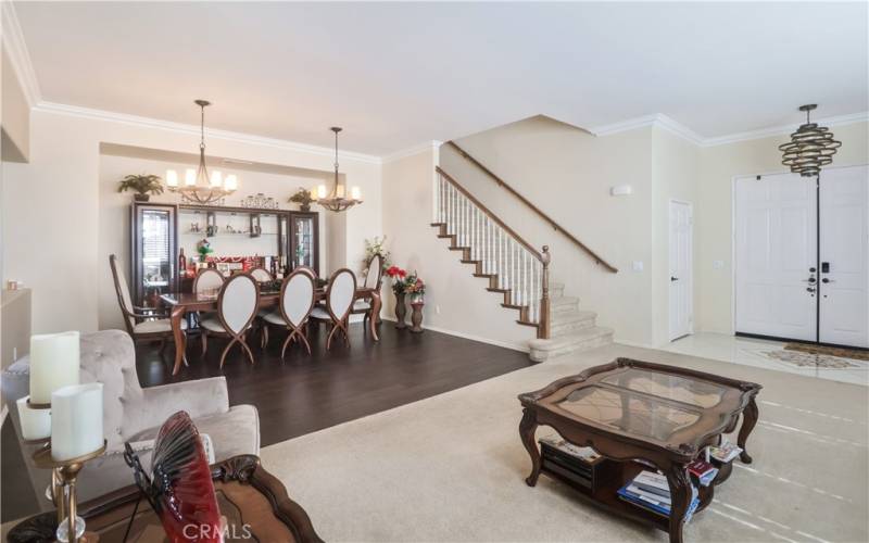 LIVING AREA WITH VEW TO DINING AREA & STAIRS