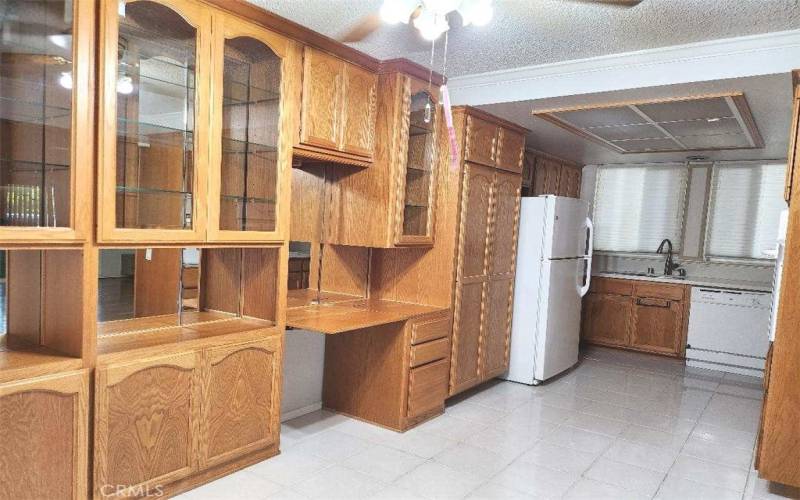 Dining area built-in cabinets showing kitchen