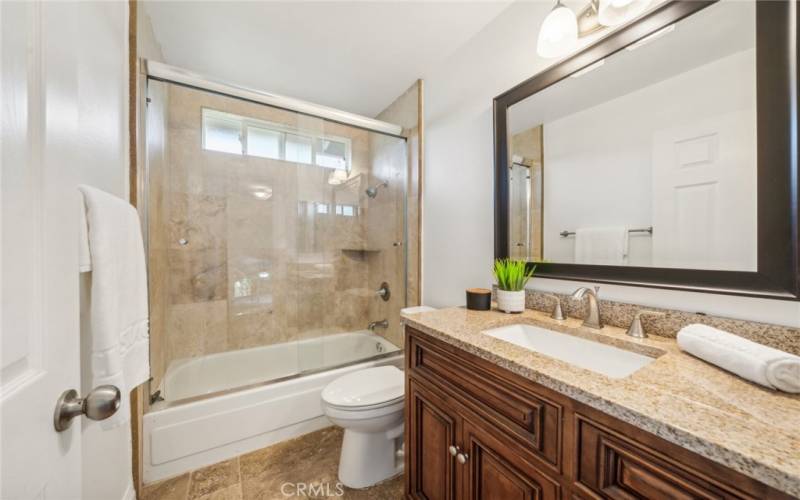 neutral finishes & updated, tiled shower/tub w/ glass panels