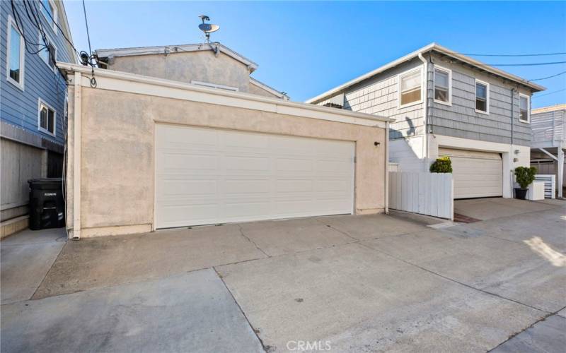 This is the garage, with a brand new garage door, resurfaced garage floor, new washer and dryer inside and room for storage too.