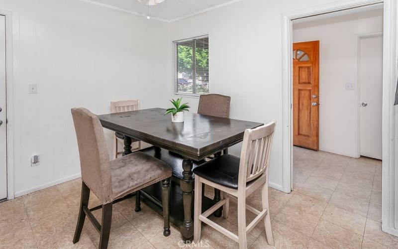 The dining nook is conveniently located just off the kitchen, and with its lighted ceiling fan and easy-care floors, it is perfect for any occasion.