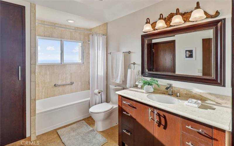 2nd bedrooms bath that also has a hall door.  Jetted tub with shower.  Towel closet for storage.
