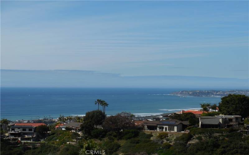 Views all the way to Palos Verde over Dana Point Harbor.  White water views of North Beach