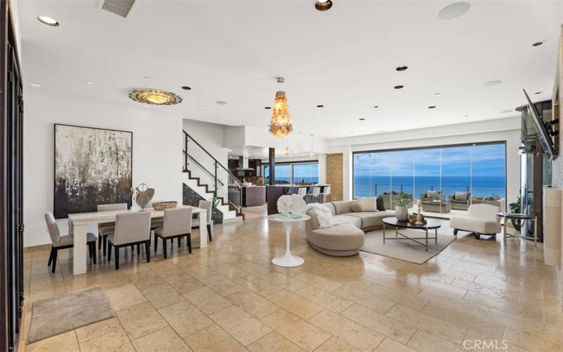 Great room that you enter the minute the front doors are opened.  Ocean views through the stack-able Glass Doors for the ultimate entertainment space.