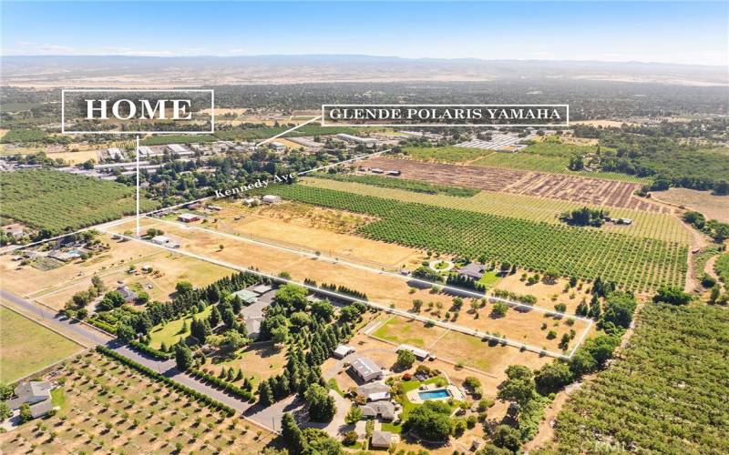 shows neighboring orchards and farms