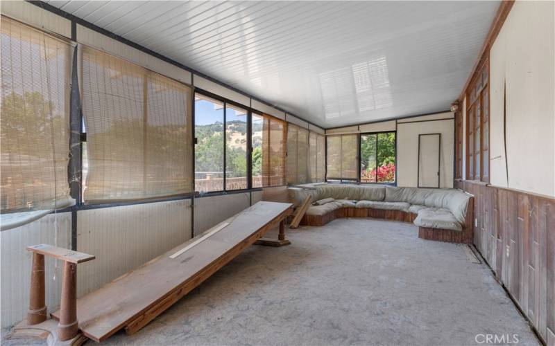 The sunroom has potential to be transformed to a beautiful space.