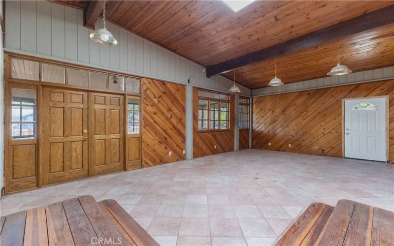 Large doors provide access to the sunroom.